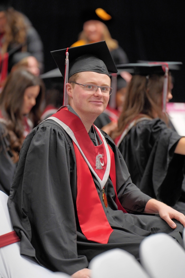 Portrait of Jack in WSU graduation regalia.